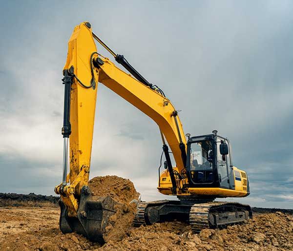 excavator digging in soil